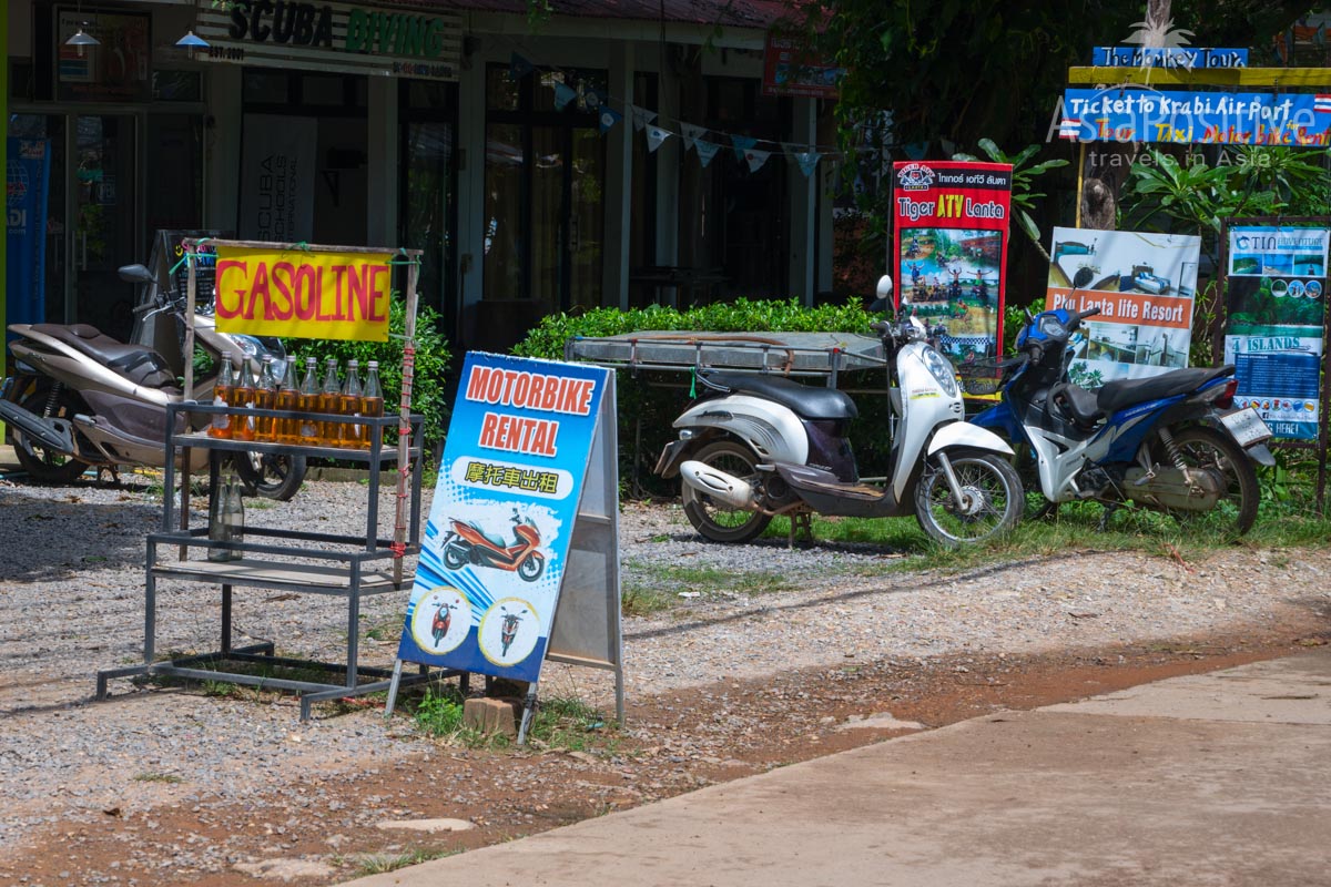 Scooters for rent and bottles with fuel on Koh Lanta (Thailand) | Travel with AsiaPositive.com